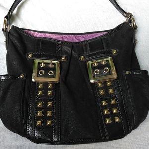 Small black purse, purple on the inside.